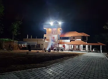 The villa lit up at night