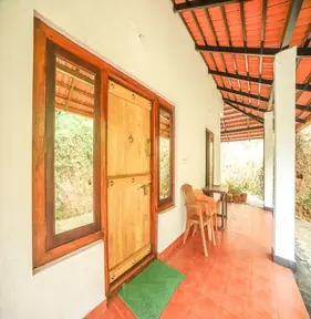 Tiled veranda outside rooms