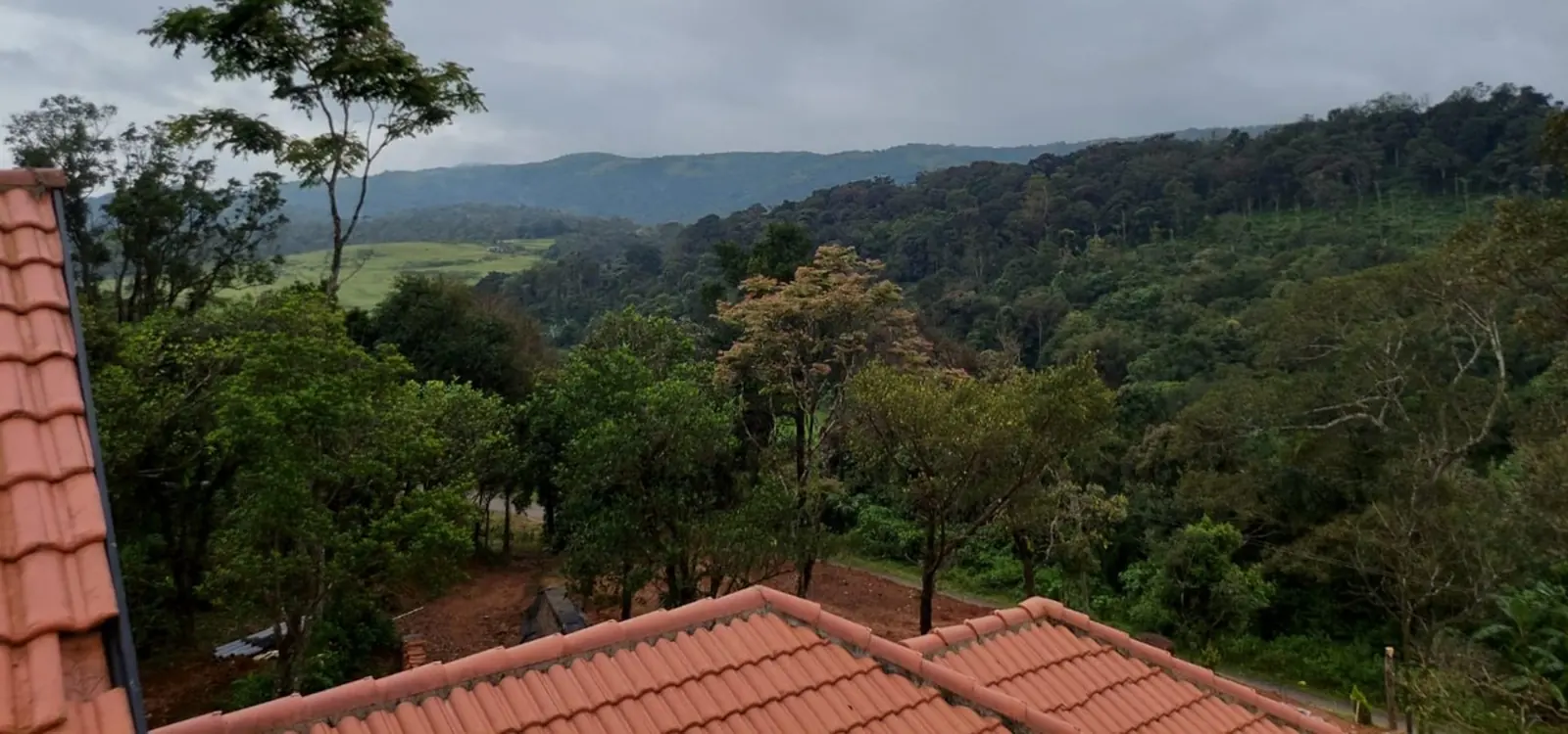 View over the roof to forested hills