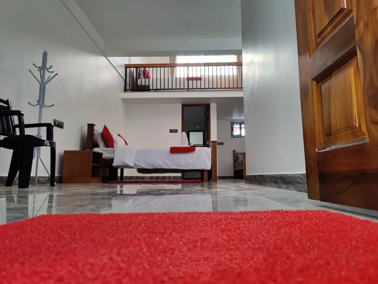 Bright double bedroom with wooden furniture