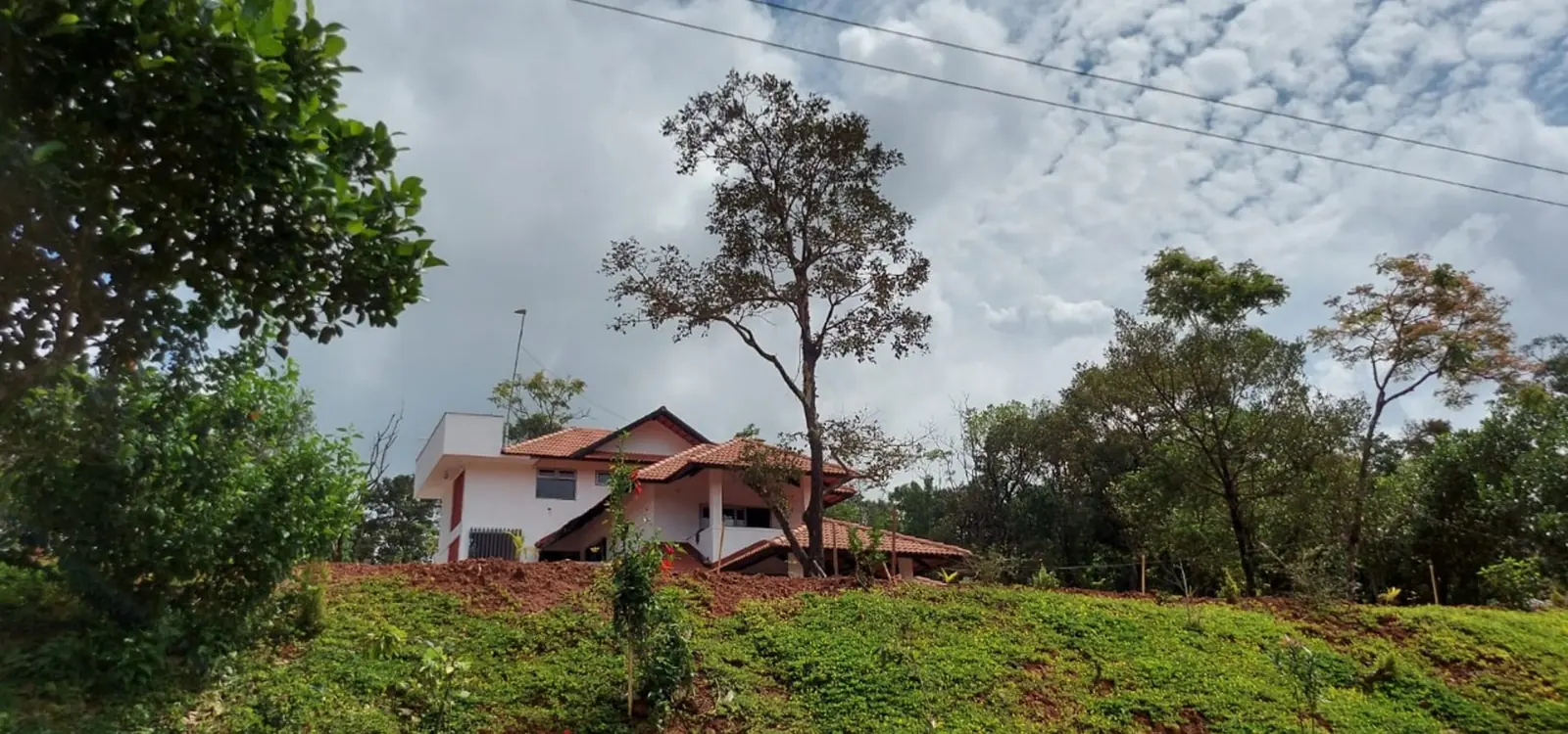 Villa on the hill under clouds